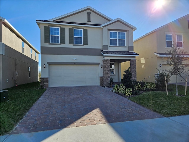 view of front of house with a garage and a front yard