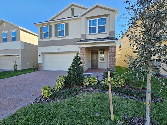 view of front of property with a garage