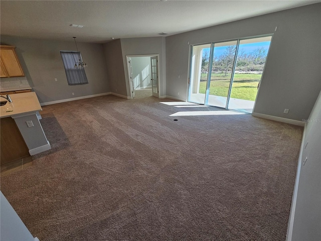 unfurnished living room featuring carpet