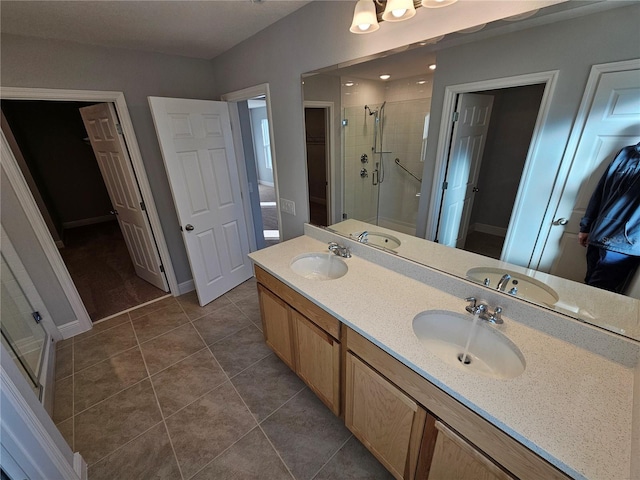 bathroom with vanity, tile patterned floors, and walk in shower