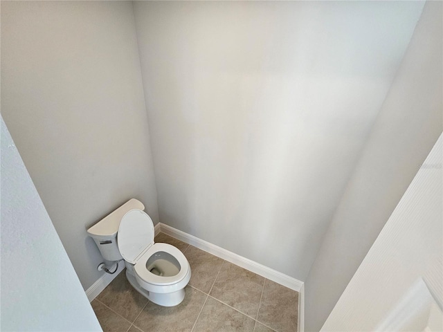 bathroom featuring tile patterned floors and toilet