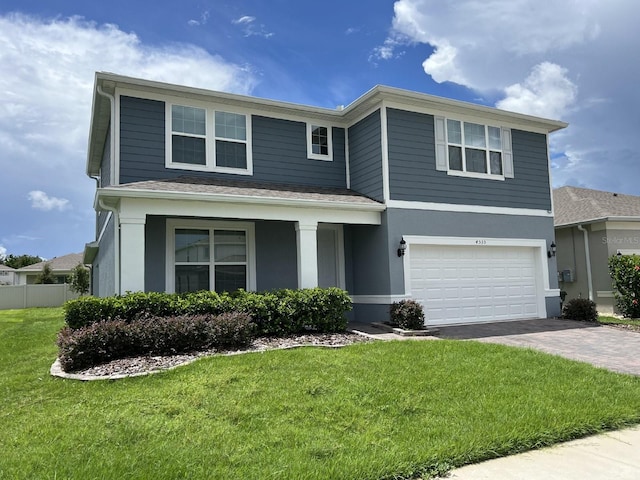 front of property with a garage and a front yard