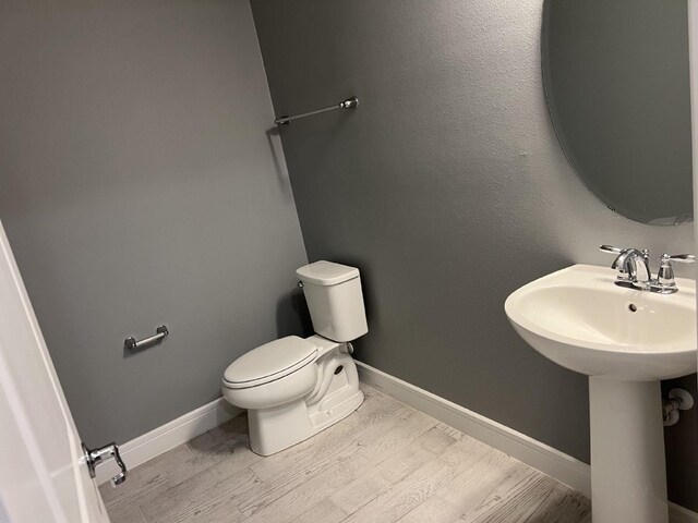 4535 Gliding Wave St, Winter Garden, FL 34787 - bathroom featuring hardwood / wood-style floors, sink, and toilet