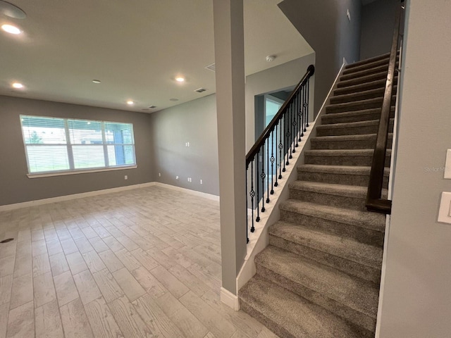 4535 Gliding Wave St, Winter Garden, FL 34787 - stairs with hardwood / wood-style floors