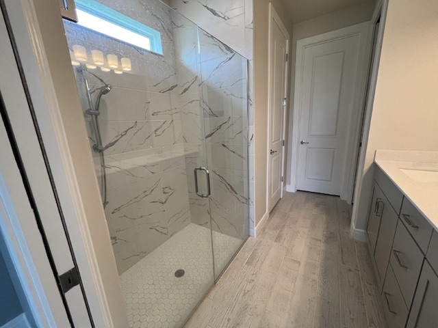 4535 Gliding Wave St, Winter Garden, FL 34787 - bathroom featuring vanity, hardwood / wood-style floors, and an enclosed shower