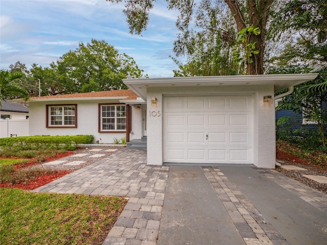 ranch-style home with a garage