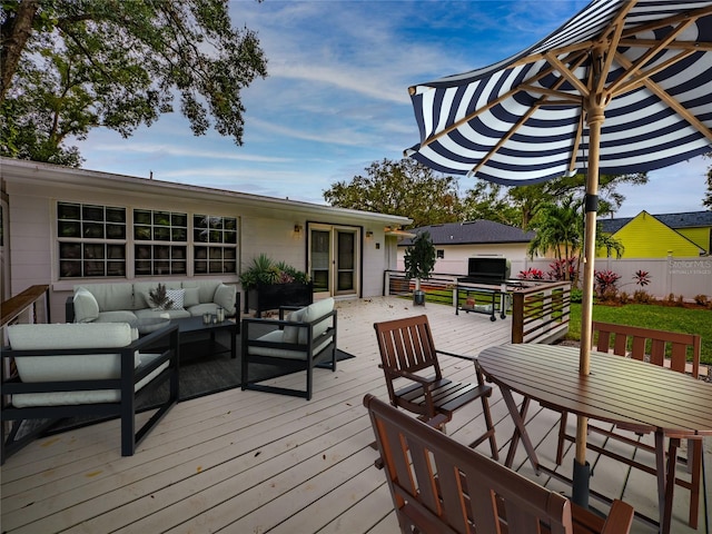 wooden deck featuring outdoor lounge area