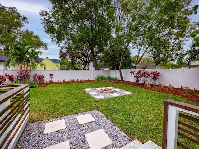 view of yard with a patio area and a fire pit