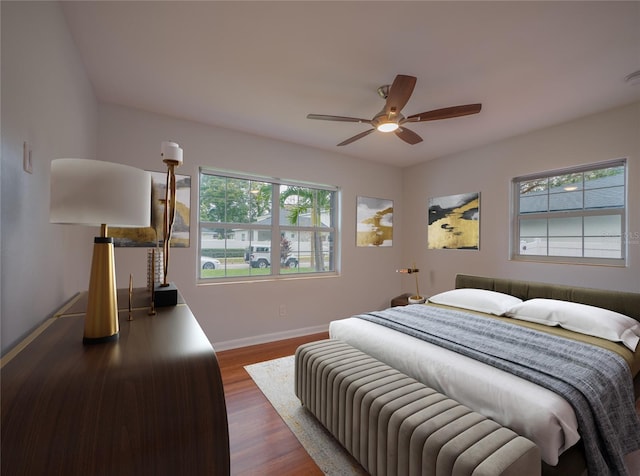 bedroom featuring ceiling fan and dark hardwood / wood-style floors