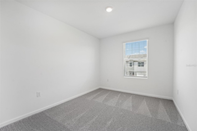 spare room featuring carpet flooring