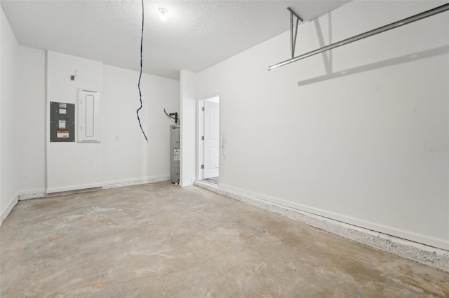 garage with electric panel and water heater