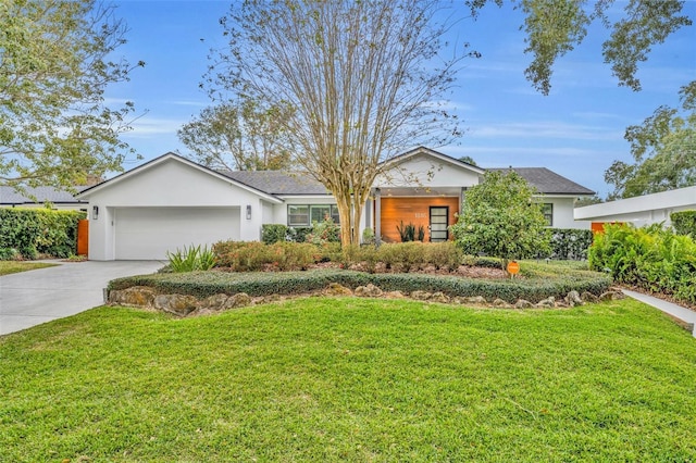 ranch-style house featuring a front yard and a garage