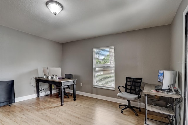 office with light wood-type flooring