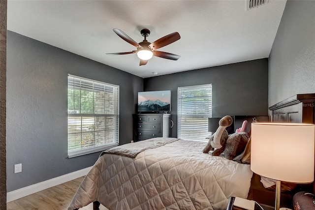 bedroom featuring ceiling fan and wood-type flooring