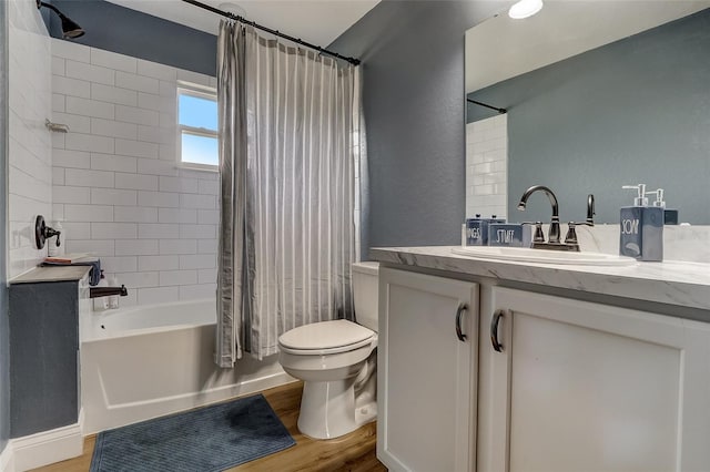 full bathroom featuring wood-type flooring, vanity, toilet, and shower / bath combo