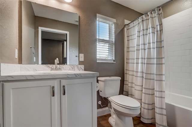 full bathroom featuring shower / bath combo, vanity, hardwood / wood-style flooring, and toilet