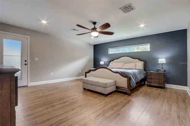 bedroom featuring light hardwood / wood-style floors and ceiling fan