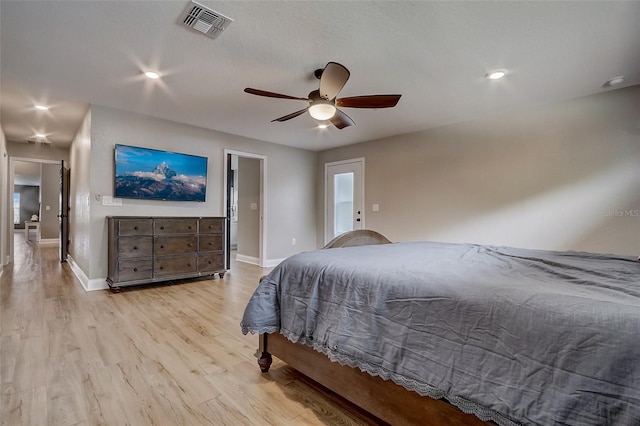 bedroom featuring light hardwood / wood-style flooring and ceiling fan