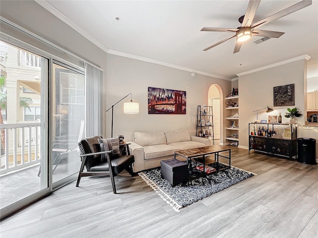 living room with ceiling fan, ornamental molding, and hardwood / wood-style floors