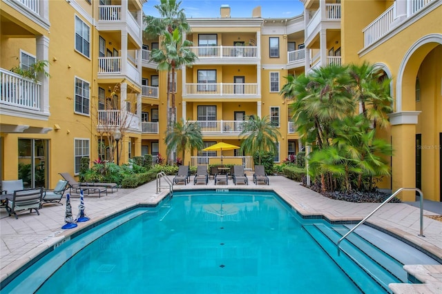 view of swimming pool with a patio