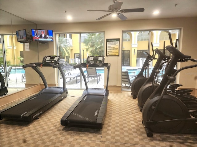 gym featuring light colored carpet and ceiling fan