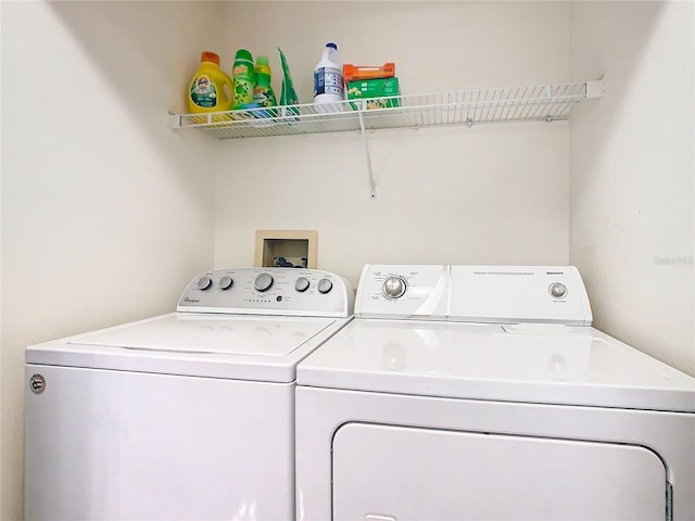 laundry room with washing machine and clothes dryer