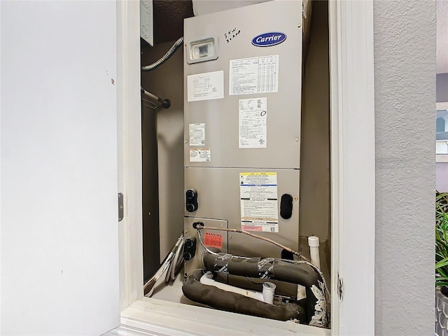 utility room with heating unit