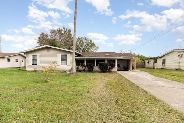 ranch-style home with a garage and a front lawn