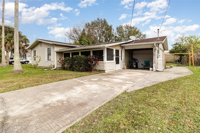 single story home with a garage and a front lawn