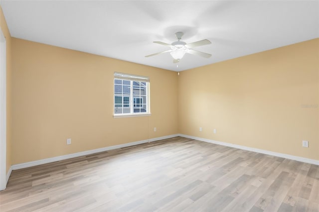 unfurnished room featuring ceiling fan and light hardwood / wood-style flooring