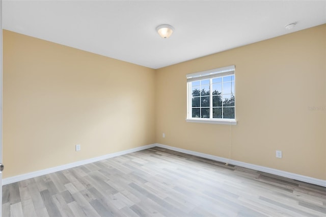 spare room featuring light wood-type flooring