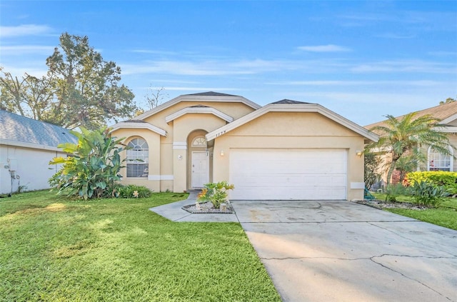 ranch-style home featuring a front yard and a garage