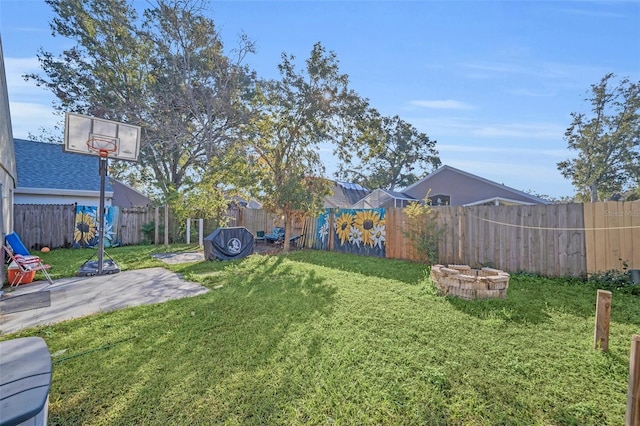 view of yard with a patio area and a fire pit