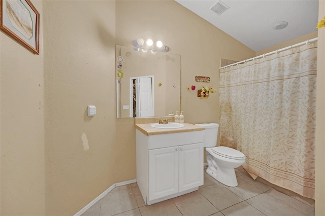 bathroom with toilet, vanity, tile patterned floors, and a shower with shower curtain