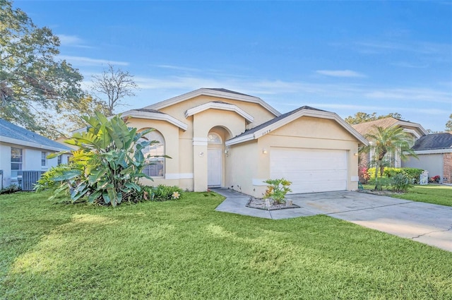 ranch-style home featuring a garage and a front lawn