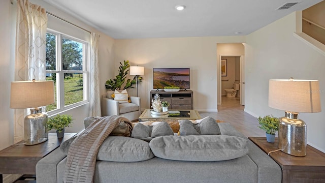 living room with light tile patterned flooring