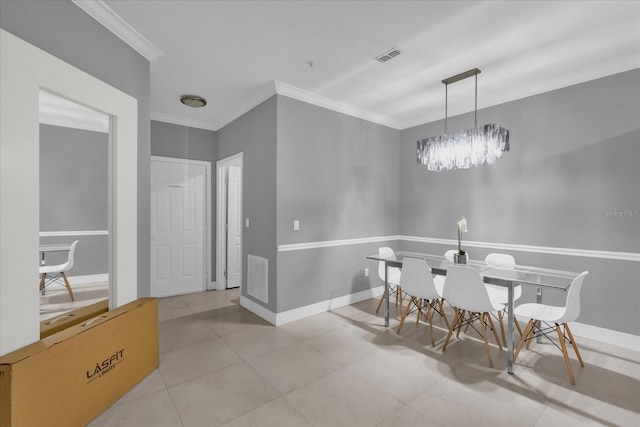 dining area with light tile patterned flooring, crown molding, and an inviting chandelier