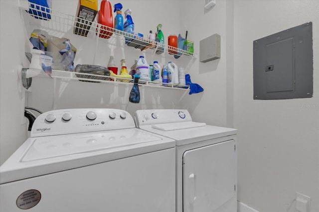 laundry area with separate washer and dryer and electric panel