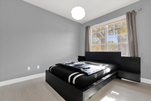 bedroom with light hardwood / wood-style flooring