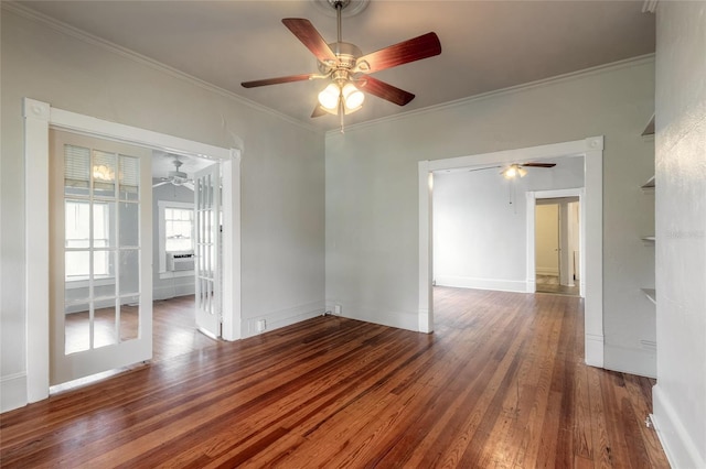 empty room featuring crown molding and dark wood-type flooring