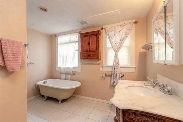 bathroom with vanity, tile patterned floors, and a bathing tub