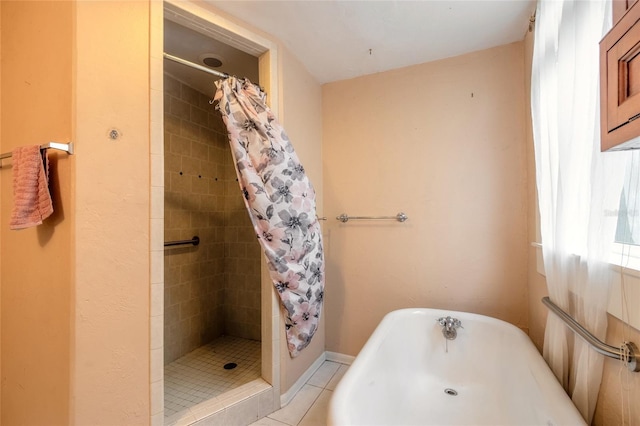 bathroom with walk in shower and tile patterned flooring