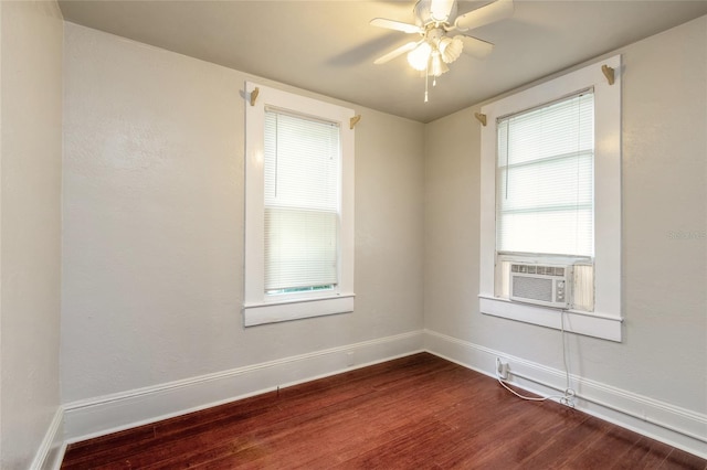 spare room featuring cooling unit, ceiling fan, and hardwood / wood-style floors