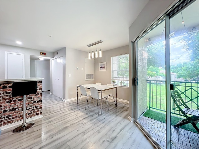 dining room featuring light hardwood / wood-style flooring