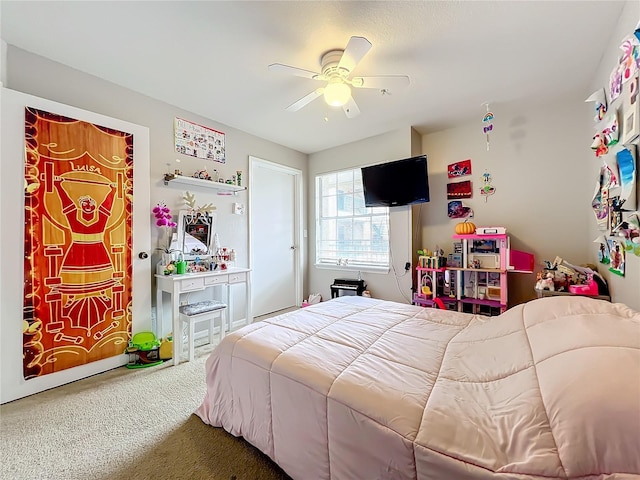 bedroom featuring ceiling fan and carpet floors