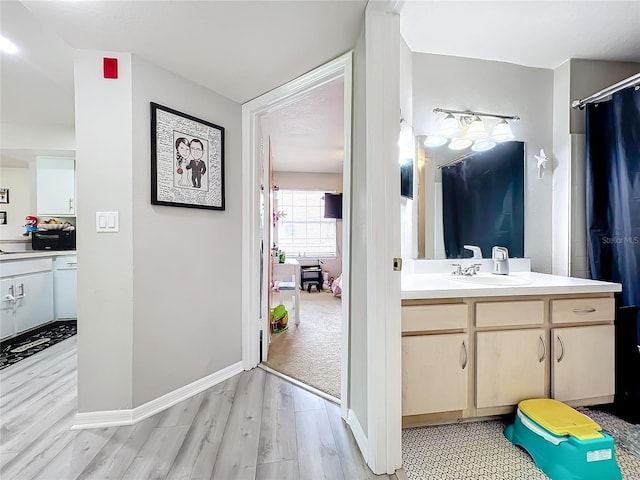 bathroom featuring vanity and wood-type flooring