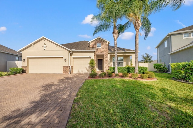 view of front of property with a garage and a front yard