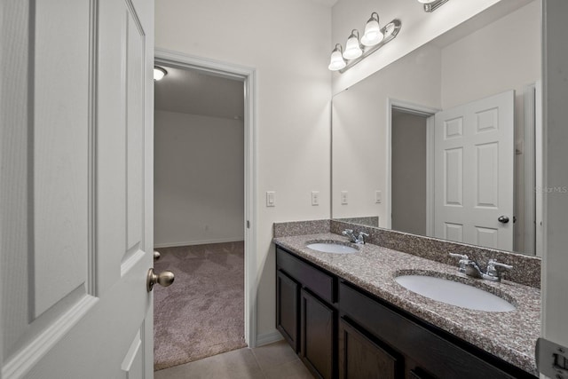 bathroom featuring tile patterned flooring and vanity