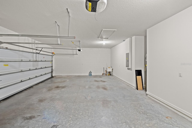 garage with electric panel and a garage door opener