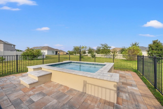 view of swimming pool with a lawn and a patio